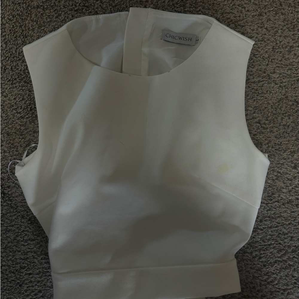 White top with a tie bow